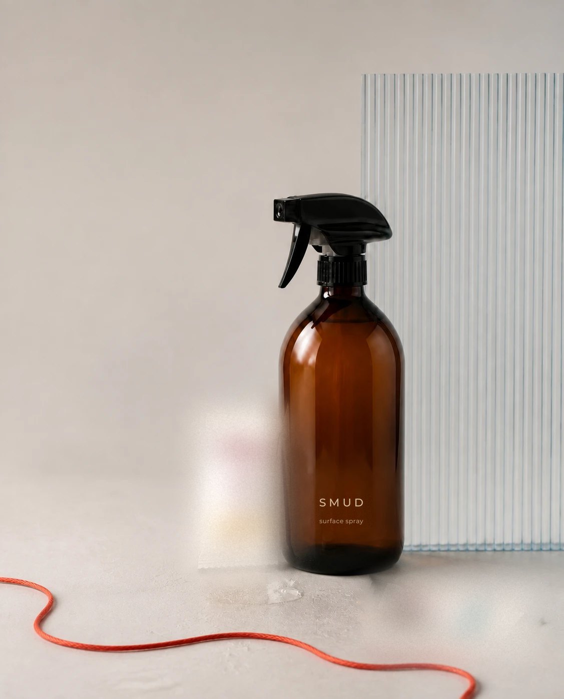 SMUD surface spray with tablet sachets, a ribbed glass panel and a red cord